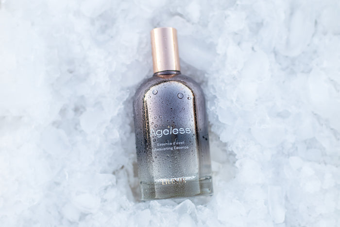 Bottle of 'Ageless' serum on an ice textured white background