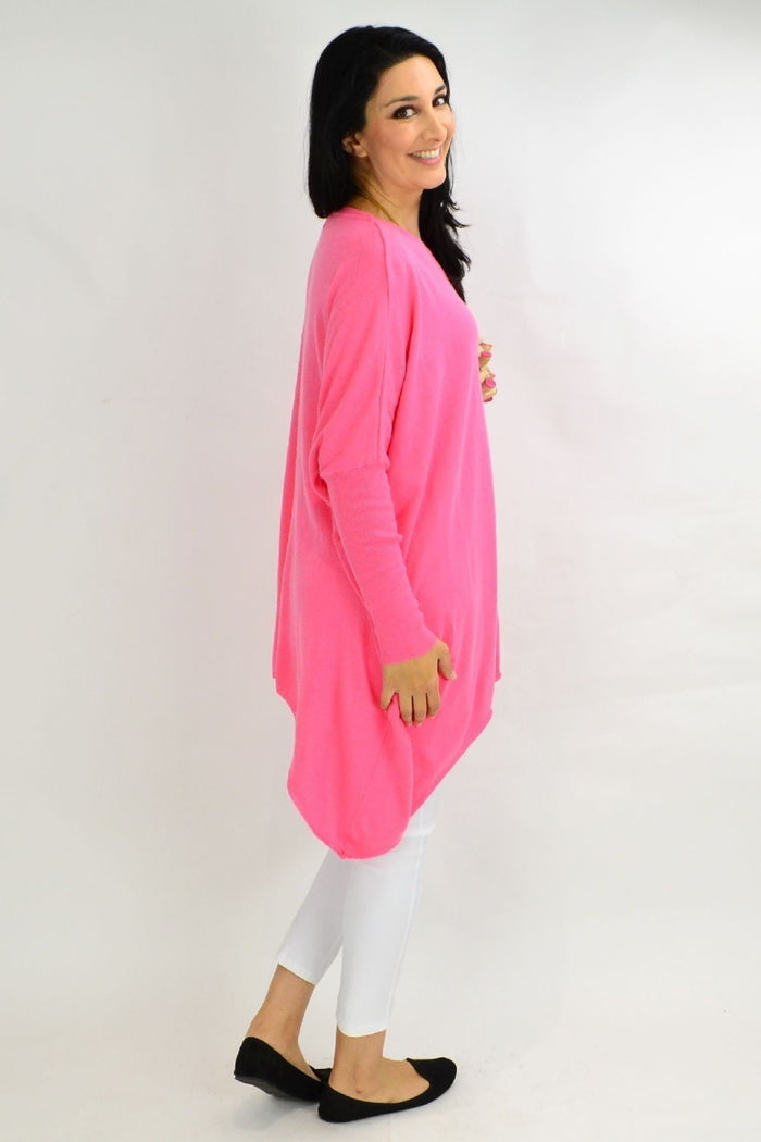 Pink Bubble Gum Snuggle Up Tunic Top by Boho Australia, featuring a relaxed fit and cozy fabric, displayed on a hanger.