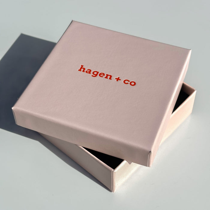 Pink gift box with hagen + co logo in orange on the lid - ANNIE.G