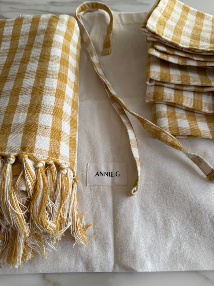 Gold Gingham Cotton Napkin Set of 4, tablecloth and white storage bag on bench - ANNIE.G