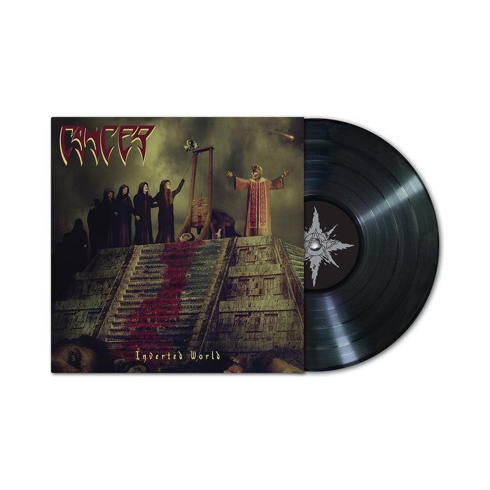A black vinyl record partially pulled from its sleeve. The sleeve features dark artwork of robed figures, a guillotine, and a crowned figure. “Cancer” and the death metal album title “Inverted World” are visible.