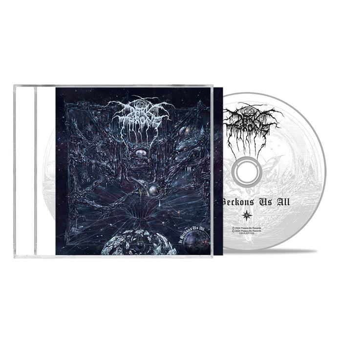 A Darkthrone Black Metal CD case and disc. The cover shows a dark cosmic scene with abstract designs, while the disc mimics black vinyl with a black-and-white “Beckons Us All” logo. Brand: Darkthrone.