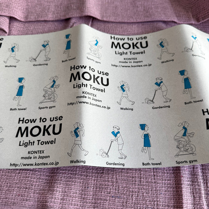 Instructions for using MOKU Light Towel on a pink towel.
