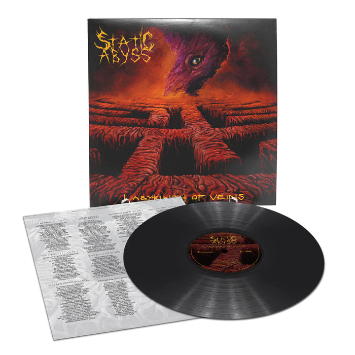 A vinyl record by Death/Doom metal band Static Abyss features cover art of a purple creature’s eye above a fiery maze. The Static Abyss logo and album title "Labyrinth of Veins" appear at the top, with a lyric sheet next to the record.