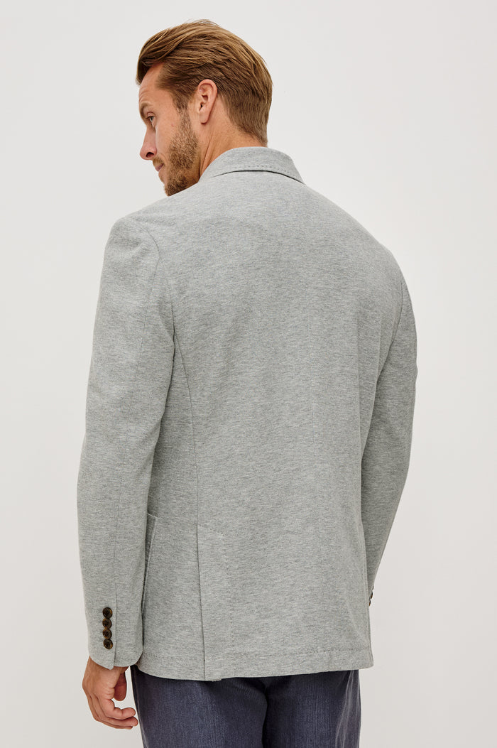 Lorenz Blazer in Cotton Blend With Notched Lapels, Long Sleeves, Front Buttons, Chest Pocket, and SIde Patch Pockets in Heather Grey Colorway - Upper Body Back View Featured on Model