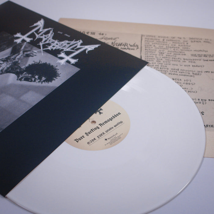A white vinyl record in a black and white Mayhem sleeve sits beside a lyric sheet with handwritten notes, song titles, and a pair of white sneakers echoing the PFA Demos era. Brand Name: Mayhem.