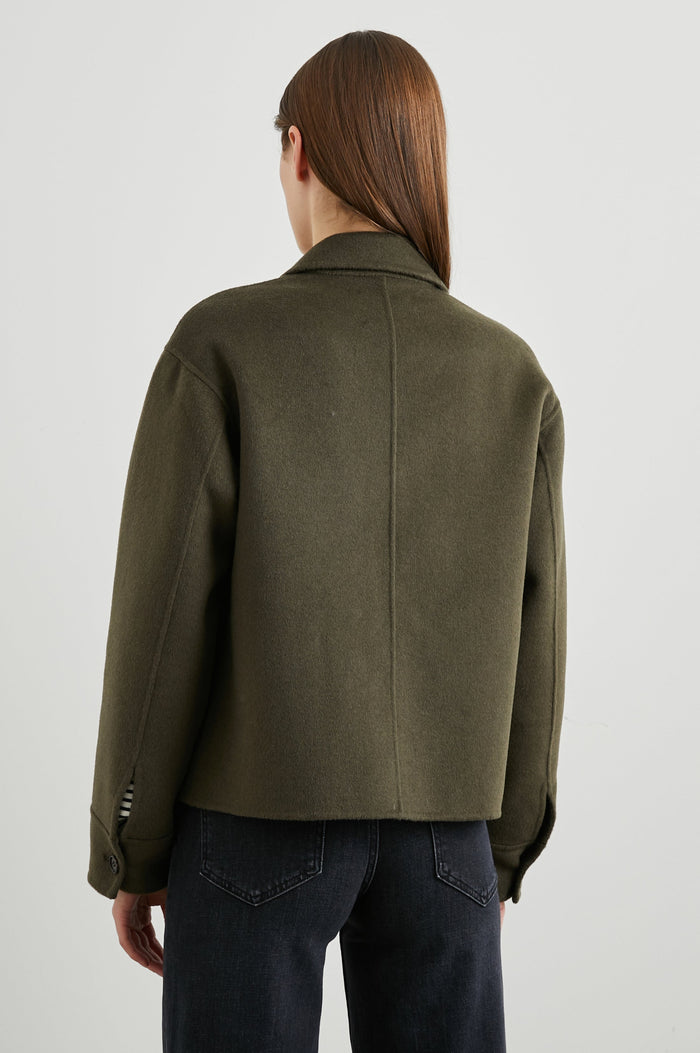 Riley Jacket with Button Closure, a Notched Collar, Two Chest Flap Pockets and Button Cuffs in Olive Colorway - Back View Featured on Model