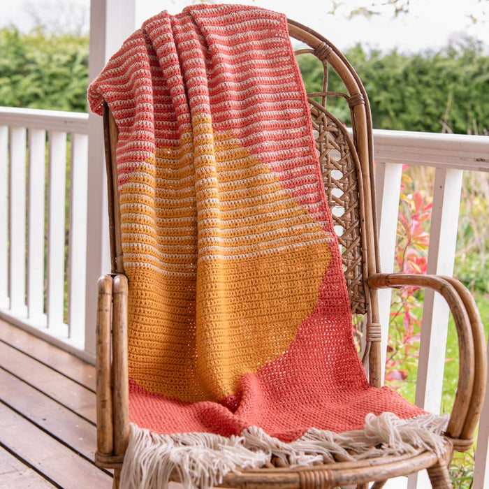 April Gopwani’s Rise and Set Blanket is inspired by the warm tones of the rising and setting sun, and features in our By Hook Collection.
