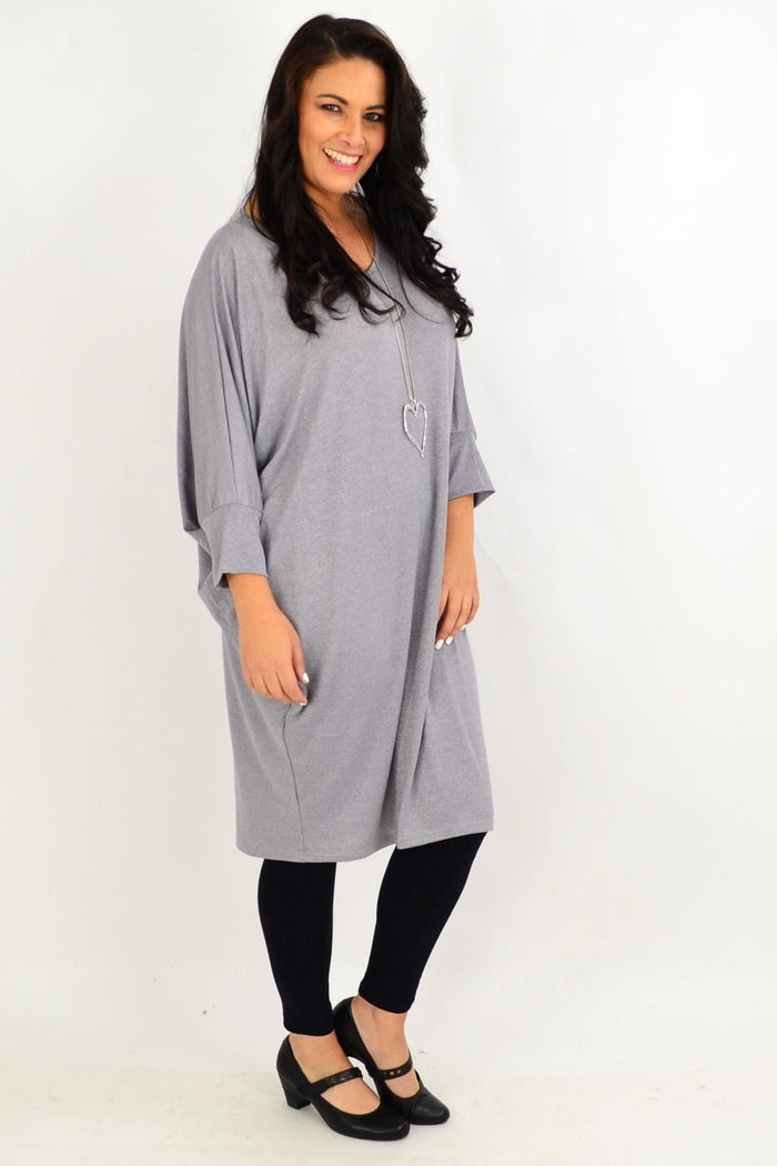 Silver grey oversized tunic dress by Lilia Whispers, flowing fabric and relaxed fit, displayed on a hanger against a neutral background.