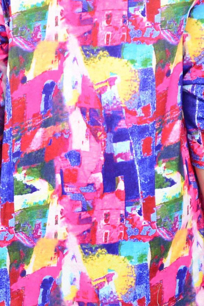 Wishstone Splash Of Colour tunic top displayed on a hanger, featuring vibrant patterns and lightweight fabric.