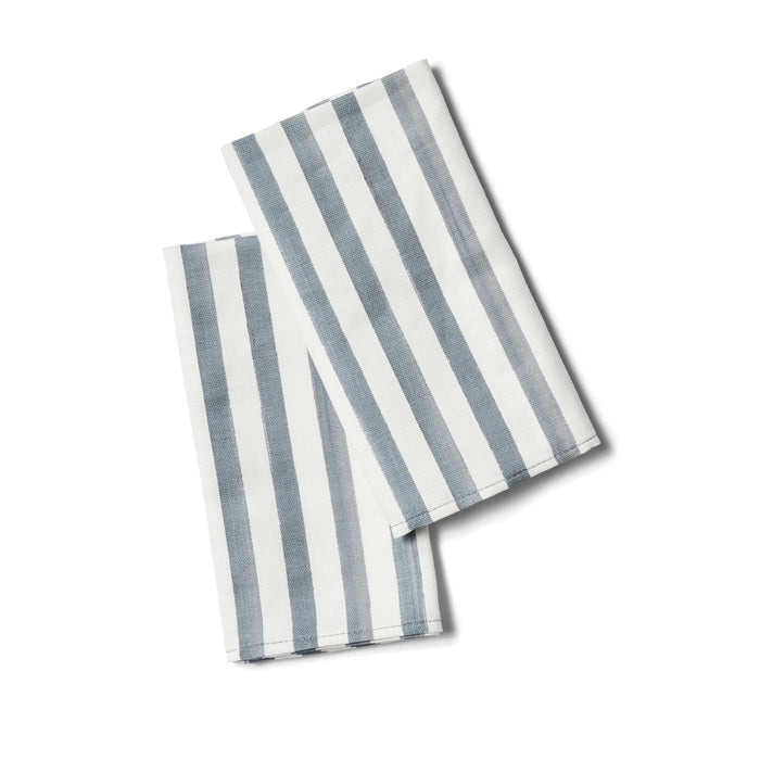 Two striped napkins with blue and white stripes folded.