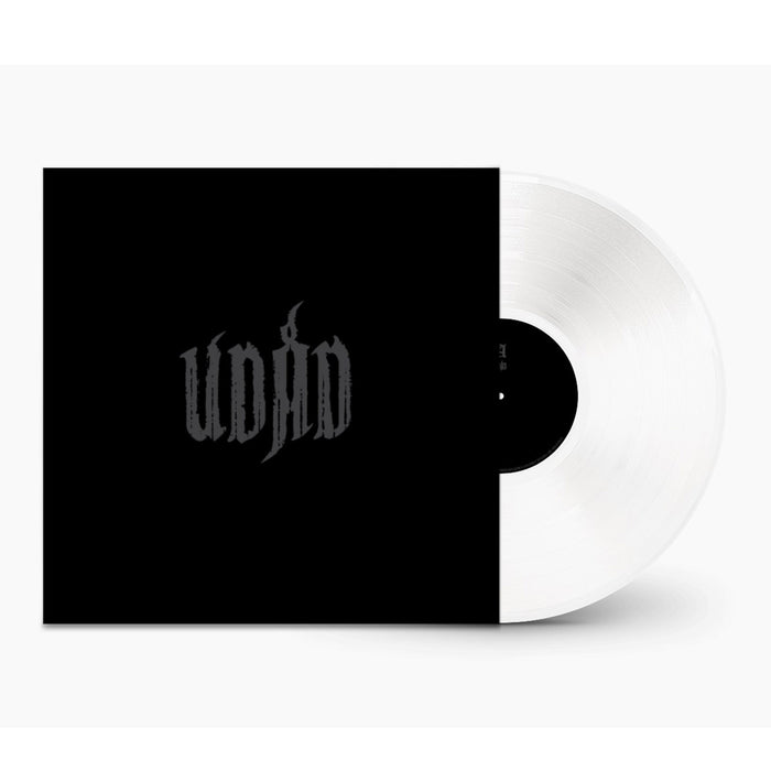 A white vinyl record is partially slid out of a black cover with "Udåd" in stylized, gray gothic lettering centered on the front—a nod to Norwegian Black Metal aesthetics. The background is plain white.
