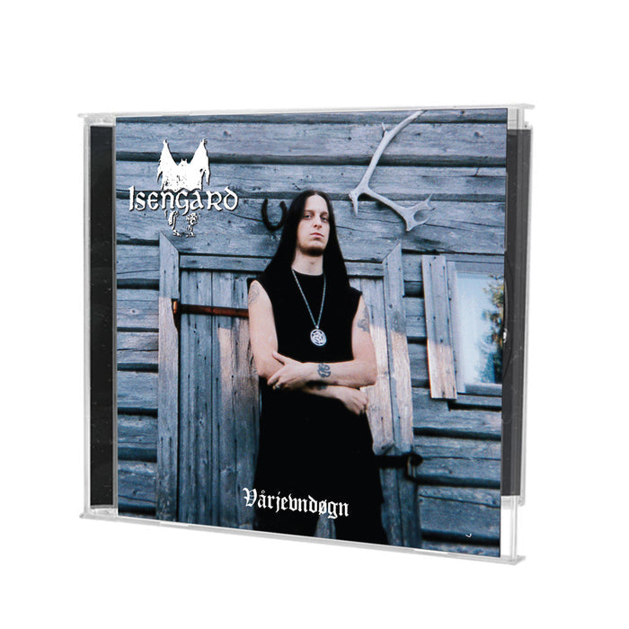 A CD case of Isengard’s cult metal album "Vandreren," showing Fenriz in black attire with long hair, standing arms folded before a rustic wooden building with antlers above the door.
