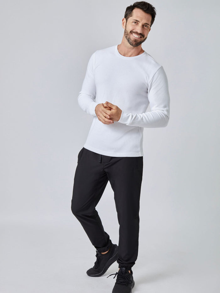 Patrick is 5'10", 163LBS and wears a size M # White Long Sleeve Thermal Crew Studio Image Full Body | Fresh Clean Threads