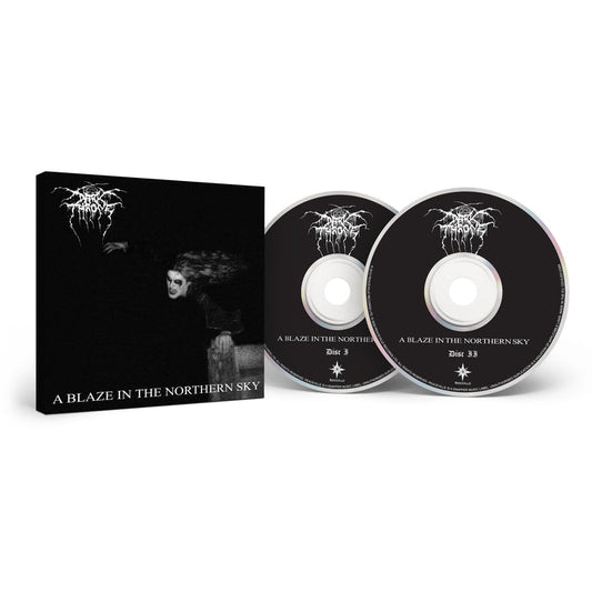 Darkthrone box set of A Blaze In The Northern Sky—Norwegian Black Metal classic—inclusive of two black CDs with white text, housed in a box featuring a dark, ghostly cover image and the album title.