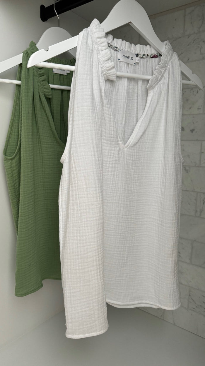White and a green cotton gauze sleeveless tank hanging on a white hanger - ANNIE.G