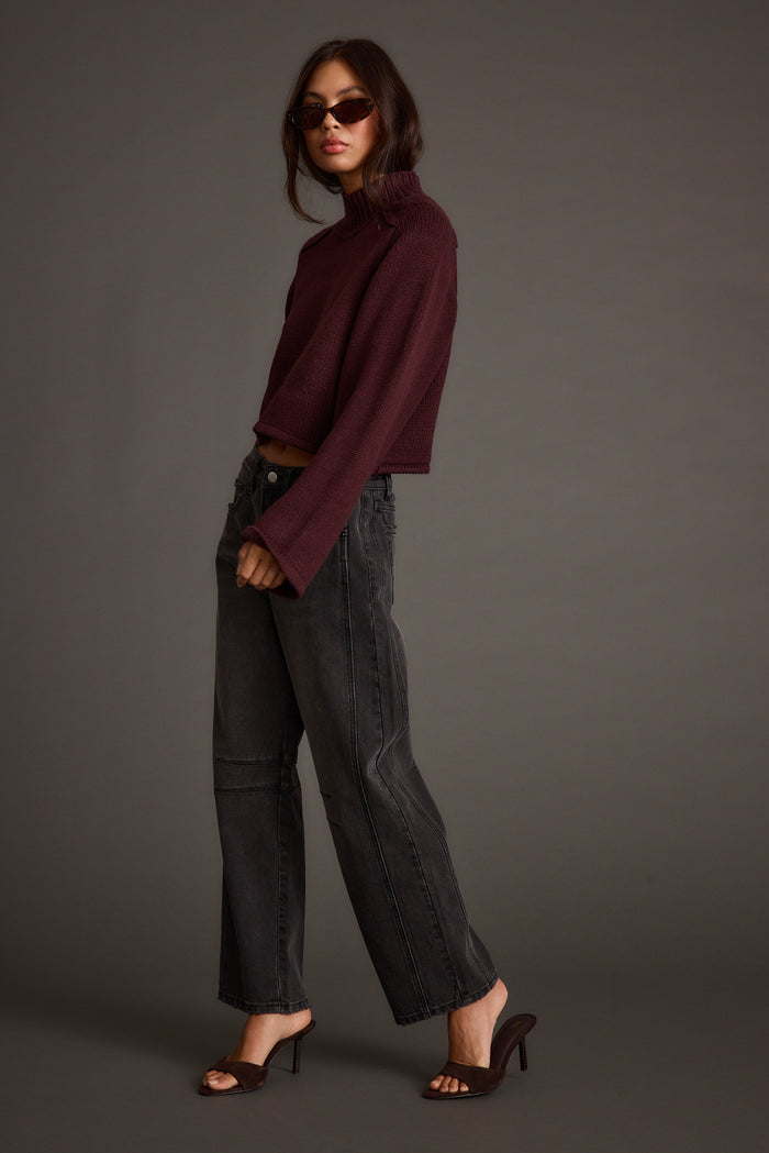 Detail shot of the Arden Plum Cropped Sweater highlighting the cropped elements.
