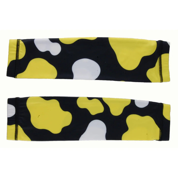 Pair of black, yellow, and white camouflage pattern arm sleeves with elastic ends on white background