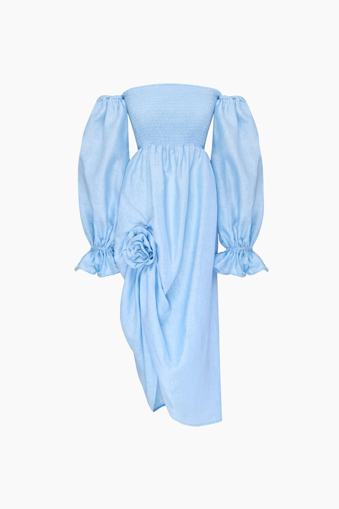 Women's midi dress with rose detail, smocked bodice and long sleeves with frill in blue.