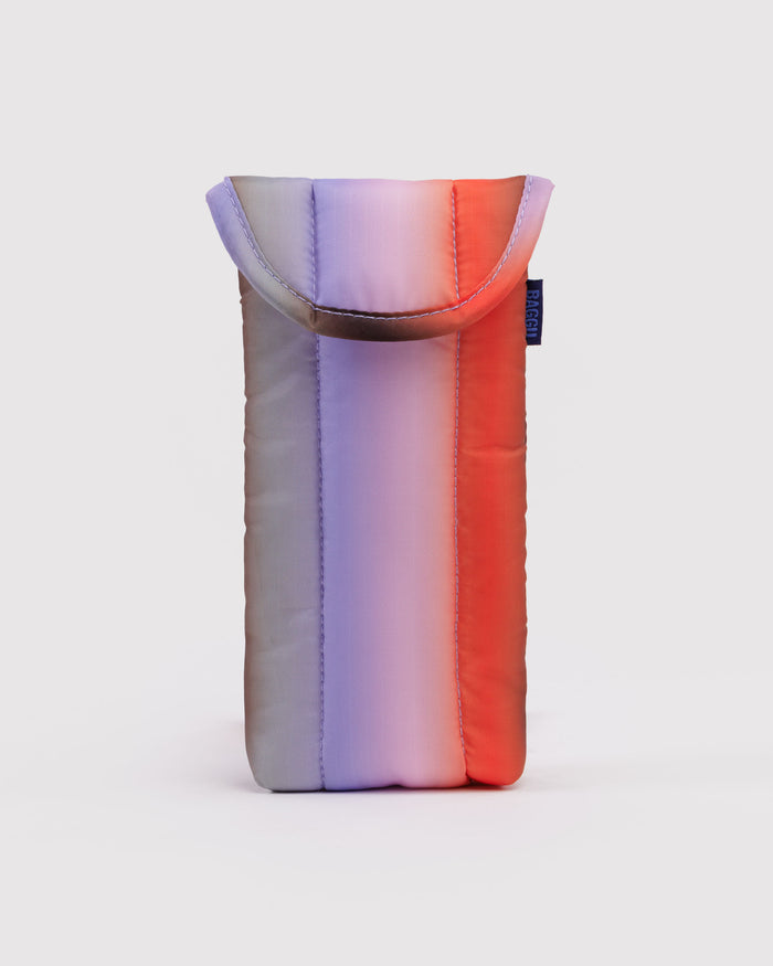 Gradient pouch in purple, pink, and red with blue BAGGU logo tag at the side.