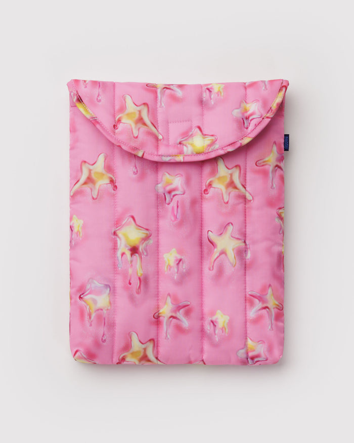 Puffy and quilted pink laptop sleeve with yellow melting star pattern.