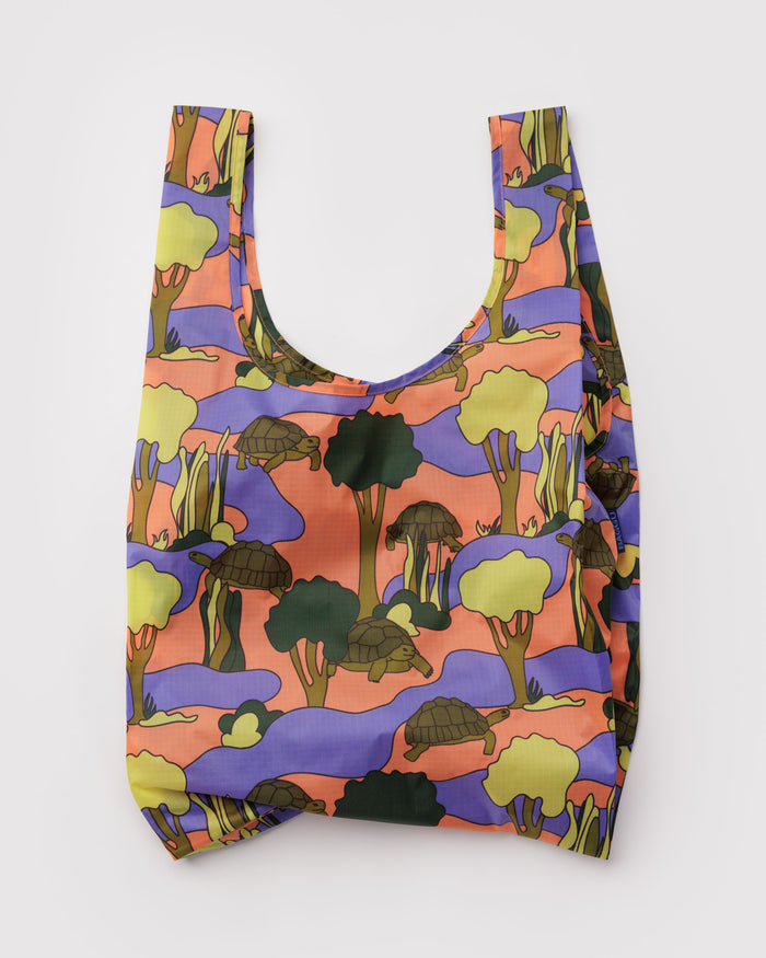 Reusable bag with a colourful forest and turtle pattern
