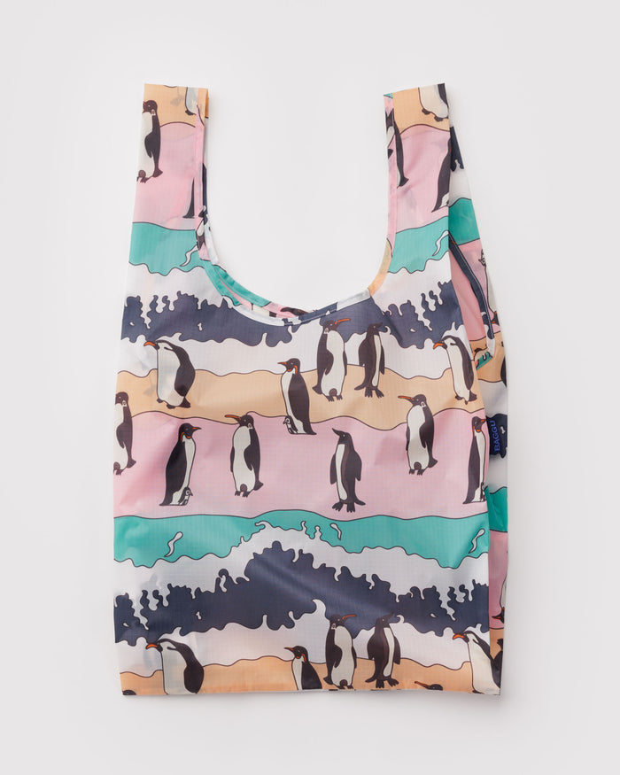 Reusable bag with penguin design on a multi-coloured background