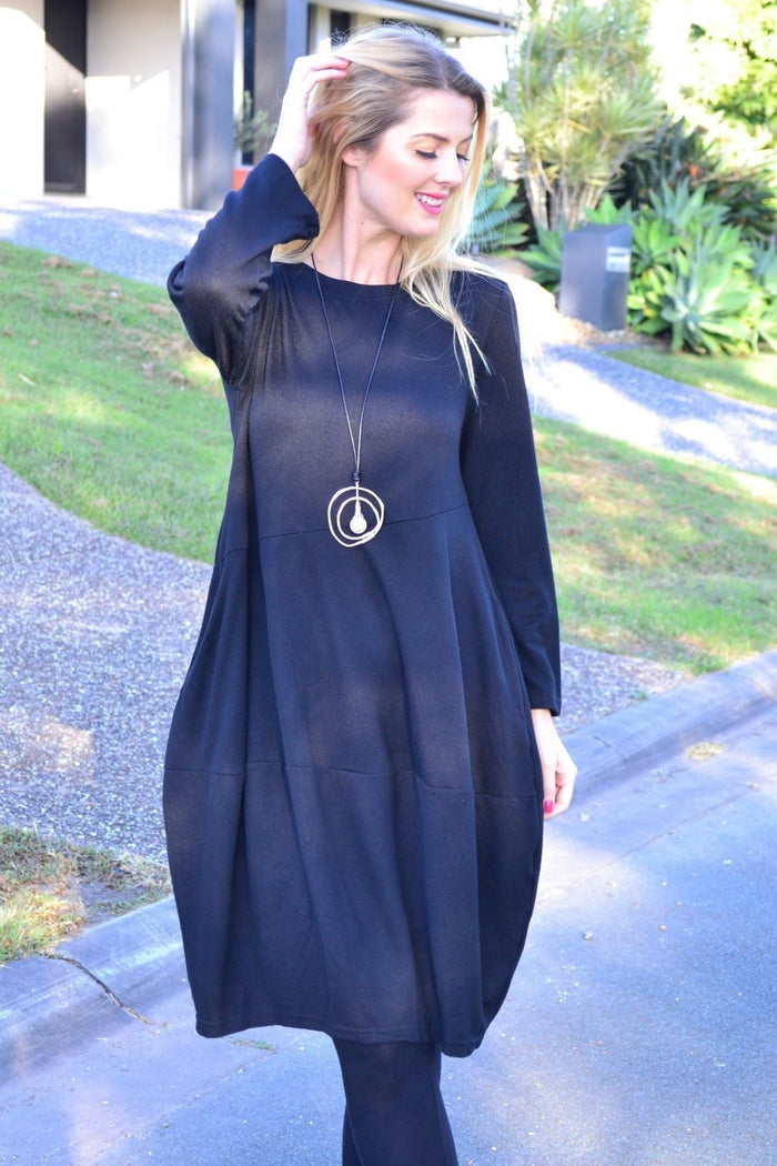 Black cocoon winter pocket tunic dress by Peony, featuring a cozy design with side pockets and a relaxed fit.