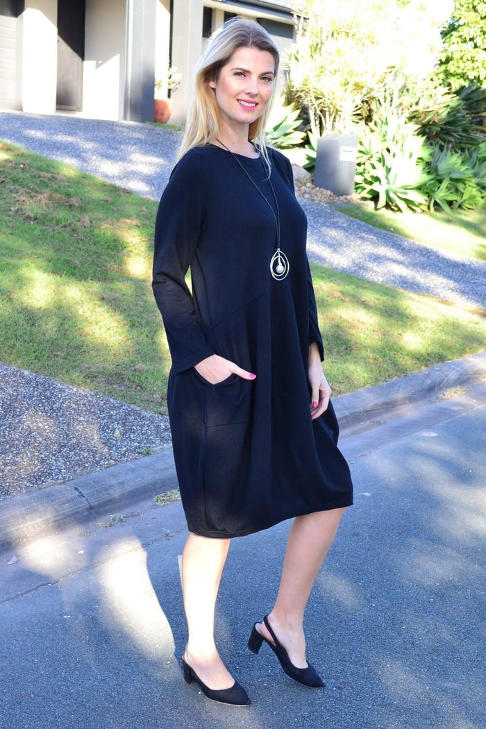 Black Cocoon Winter Pocket Tunic Dress by Peony, featuring a cozy cocoon silhouette with front pockets, perfect for winter wear.