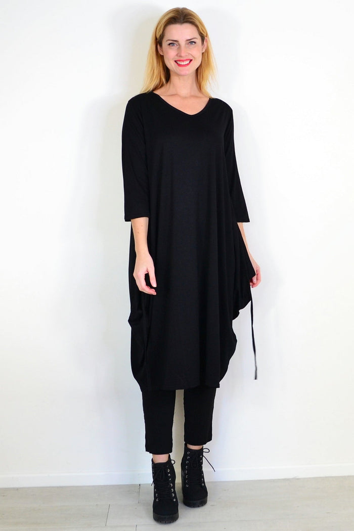 Black relaxed oversized tunic dress by Lilia Whispers, featuring a loose fit and casual style, shown on a model.