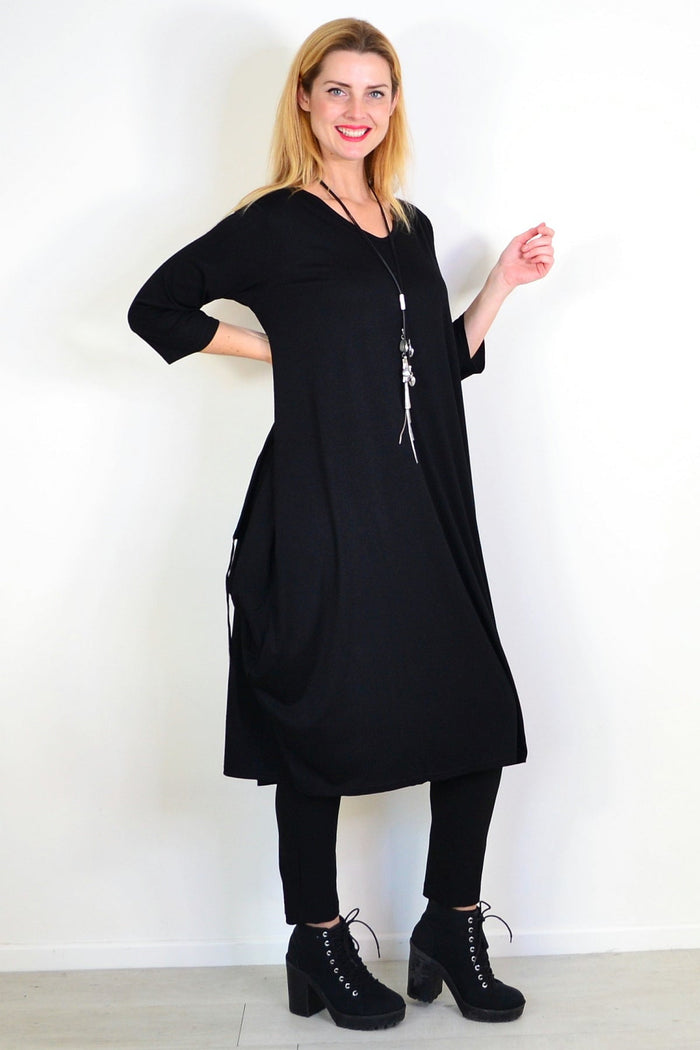Black relaxed oversized tunic dress by Lilia Whispers, featuring a loose fit and comfortable style in the image.