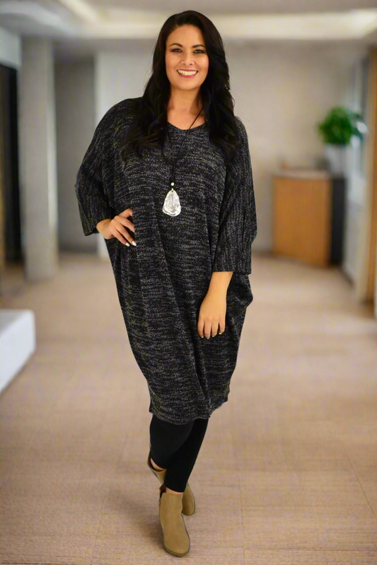 Black textured knit tunic dress by Lilia Whispers, showcasing a cozy winter tunic top with a relaxed fit and intricate knit details.