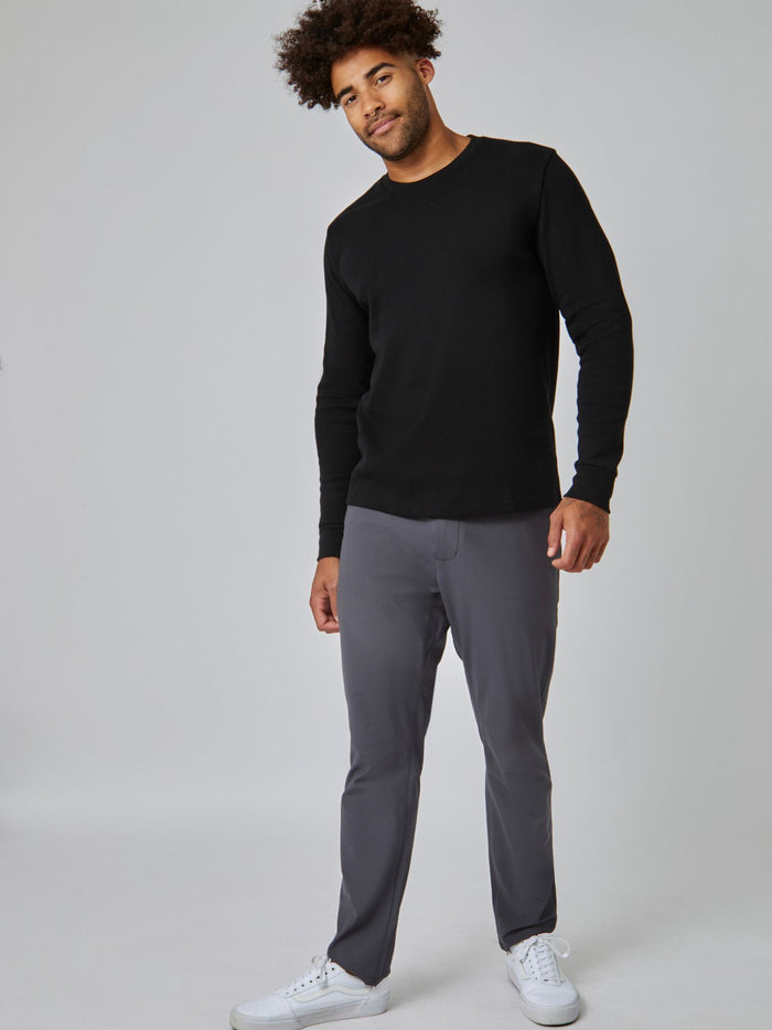 Joe is 6', 180LBS and wears a size L # Black Thermal Long Sleeve Crew Studio Full Body Image | Model Size Large | Fresh Clean Threads