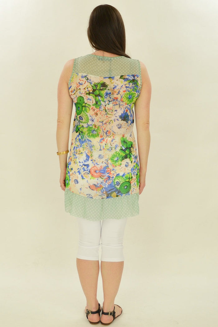 Blue Meadow Flowers Tunic by Whispers featuring a flowing fabric and vibrant floral print, displayed on a mannequin.