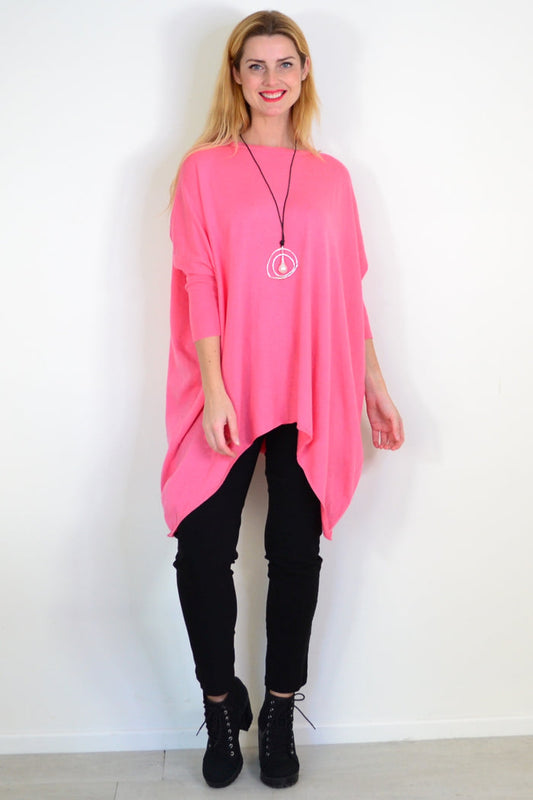 Bubble gum pink Snuggle Up Tunic Top by Boho Australia, featuring soft fabric and relaxed fit, displayed on a hanger.