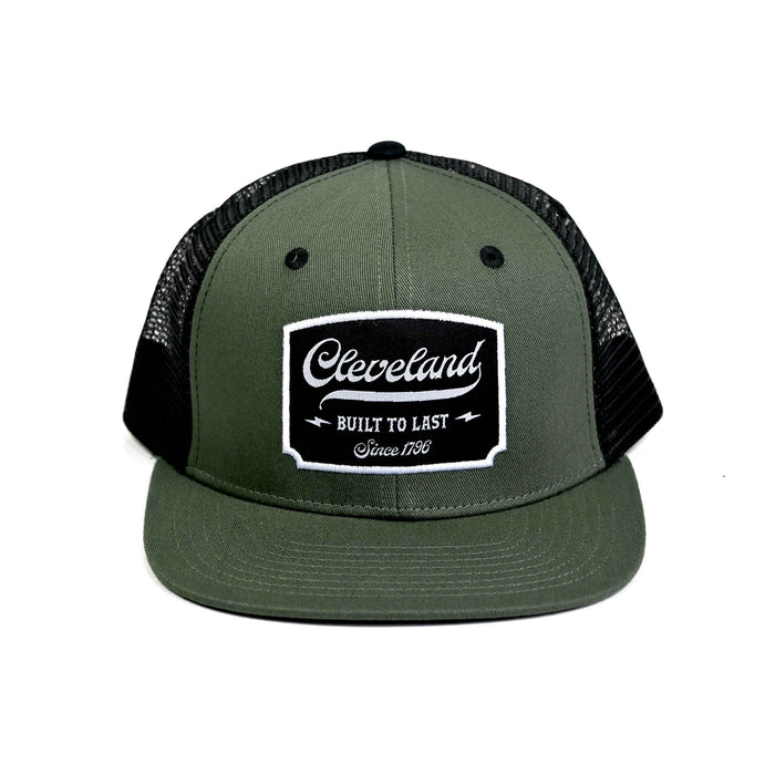 Cleveland Built to Last olive and black flat brim trucker hat front.
