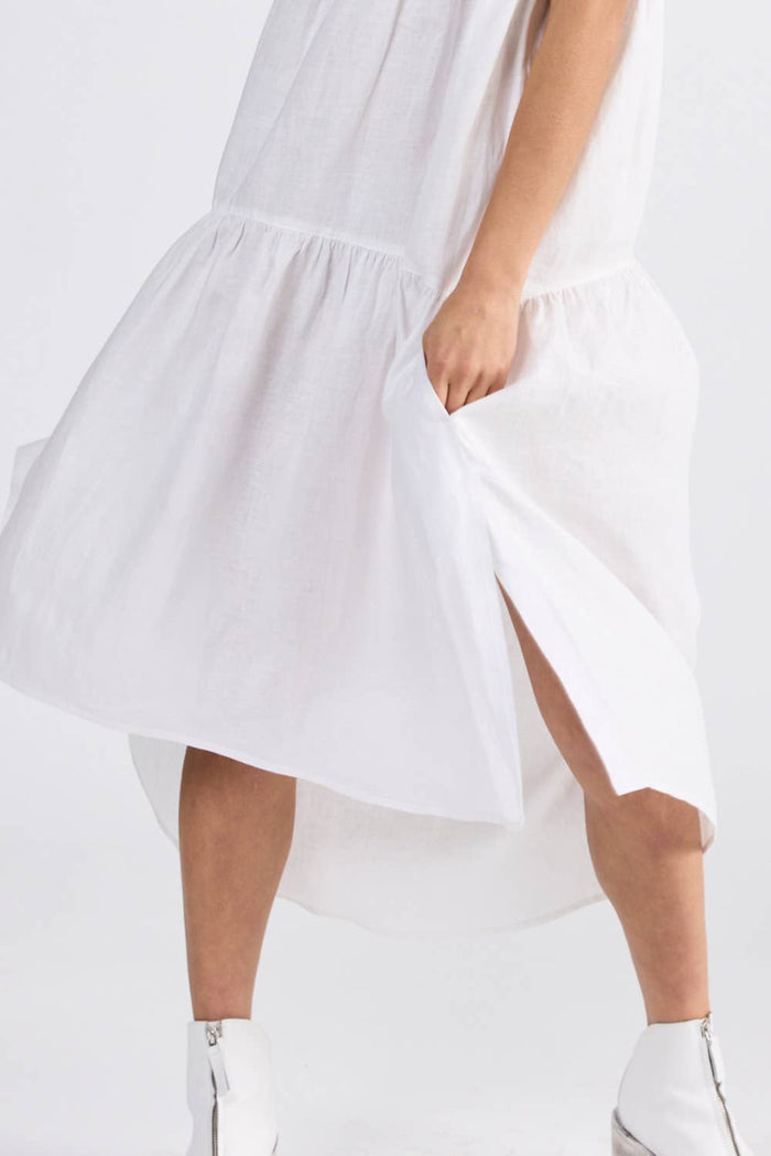 Person wearing ivory dress with side splits and dropped hem at back - ANNIE.G
