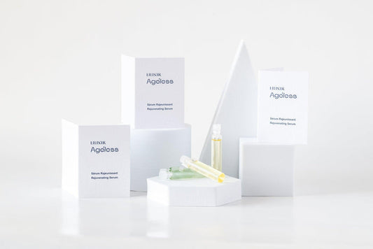 A collection of LILIXIR skincare products including a night serum sample, displayed on a white background with minimalist design packaging.