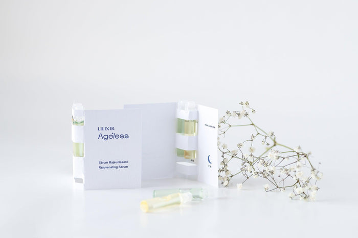 A collection of LILIXIR skincare products including a night serum sample, displayed on a white background with minimalist design packaging.