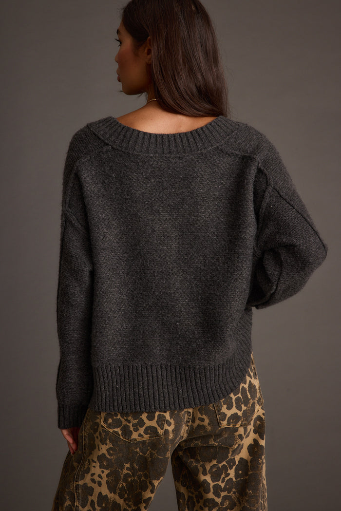 Close-up of the Colorado Charcoal V Neck Sweater showcasing the fabric texture and design details.