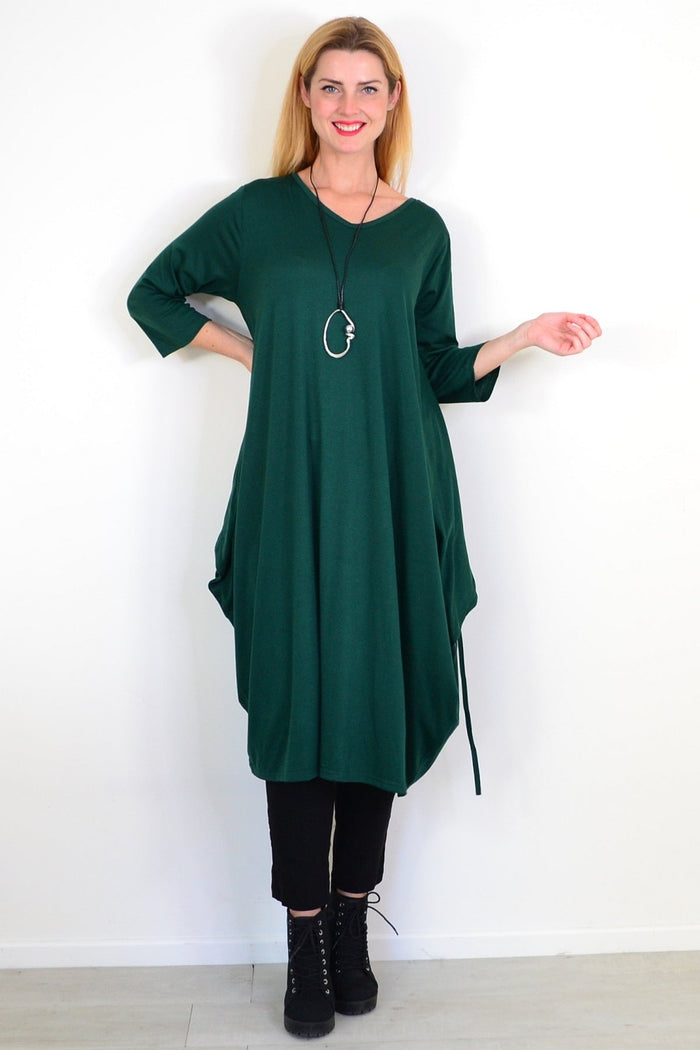 Dark green oversized tunic dress by Lilia Whispers, relaxed fit with long sleeves and a flowing silhouette.