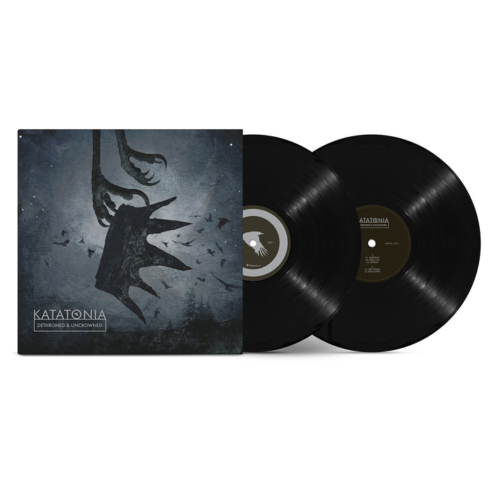 A Katatonia vinyl record set featuring the Demons of the Unknown album cover with a dark, abstract design inspired by Dead End Kings. Includes two black vinyl records displayed alongside the cover.