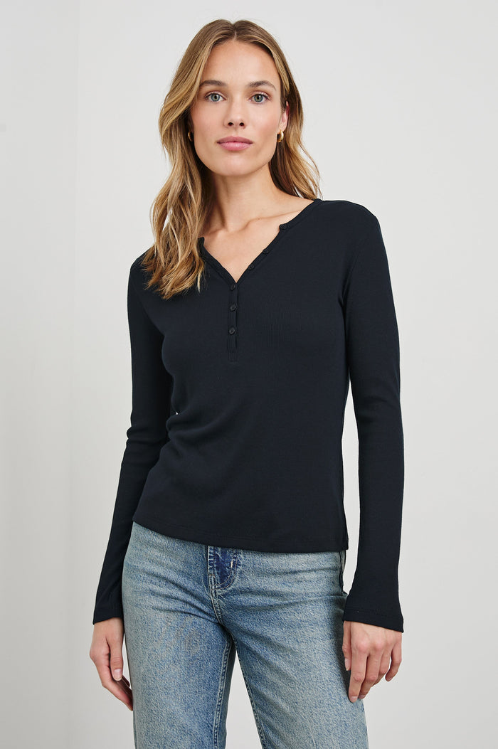 Essential Long-Sleeve Finely Ribbed Henley, with a V Neck and a Placket with Buttons in Black Colorway - Front View Featured on Model