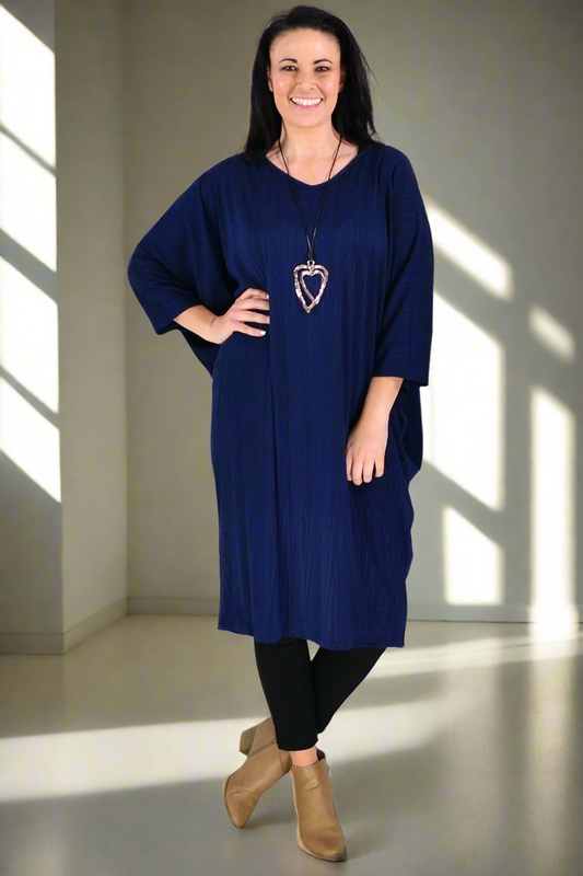 Navy ribbed oversized tunic dress by Lilia Whispers, free size, with a relaxed fit and soft fabric, displayed hanging on a plain background.