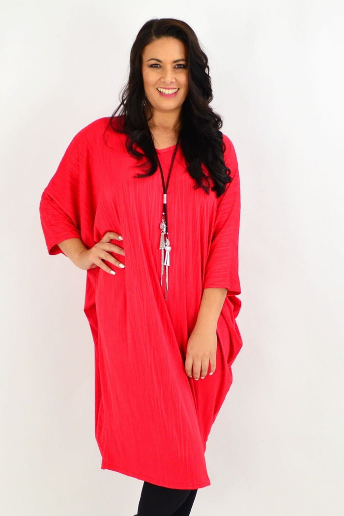 Red ribbed oversized tunic dress by Lilia Whispers, loose fit, casual style, featuring a soft, textured fabric and relaxed silhouette.
