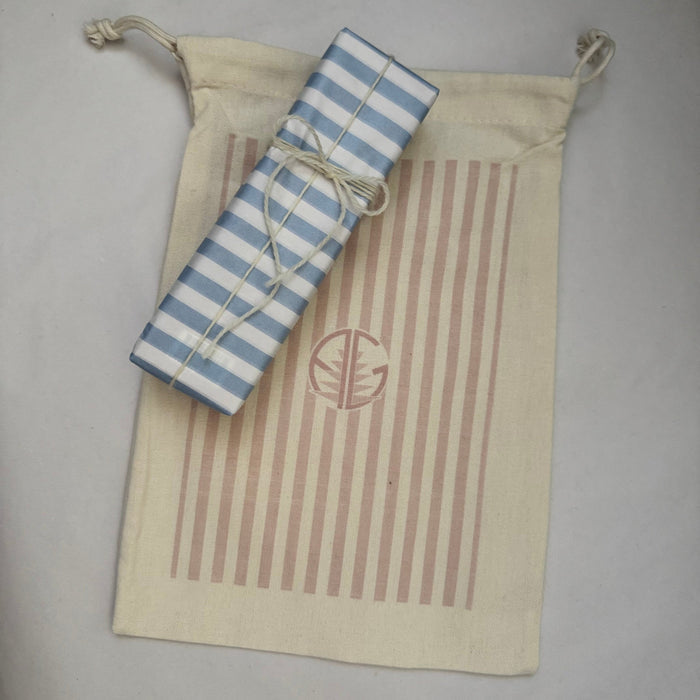 Cream and pink stripe gift bag and gift wrapped present.
