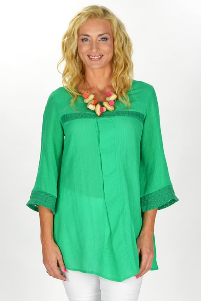 Green Goddess tunic by David Jessie, featuring a flowy, vibrant green fabric with a relaxed fit and intricate neckline detail.