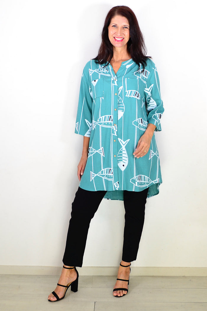 Green Ruby Rain relaxed hi-low tunic shirt with a loose fit and casual style, shown on a hanger.