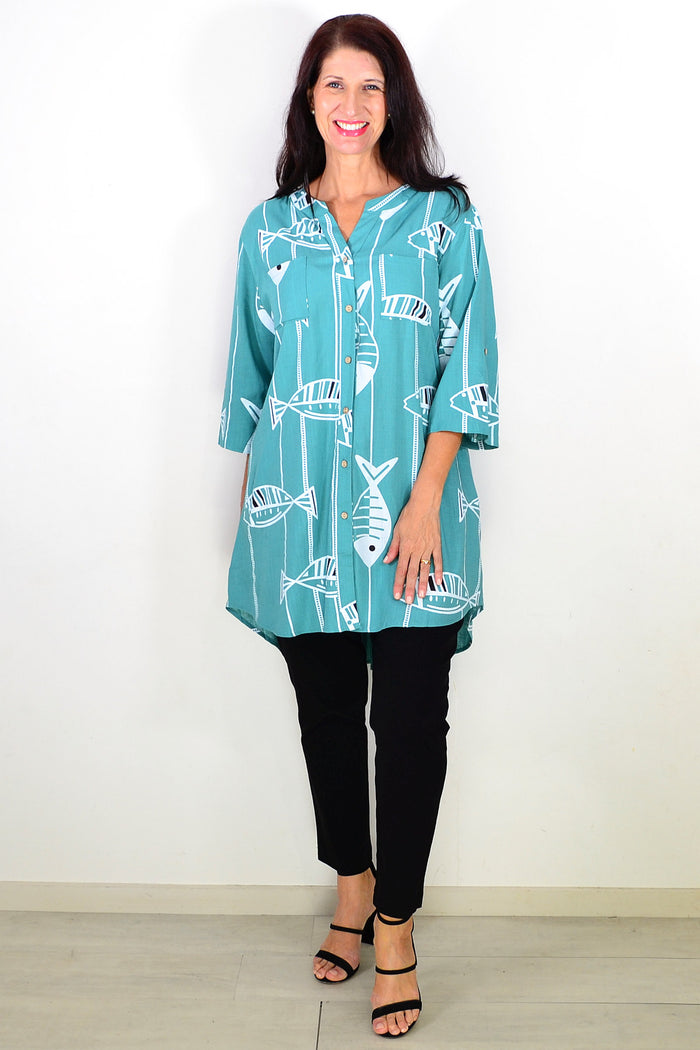 Green Ruby Rain hi-low relaxed tunic shirt with long sleeves and a casual fit, shown on a hanger.