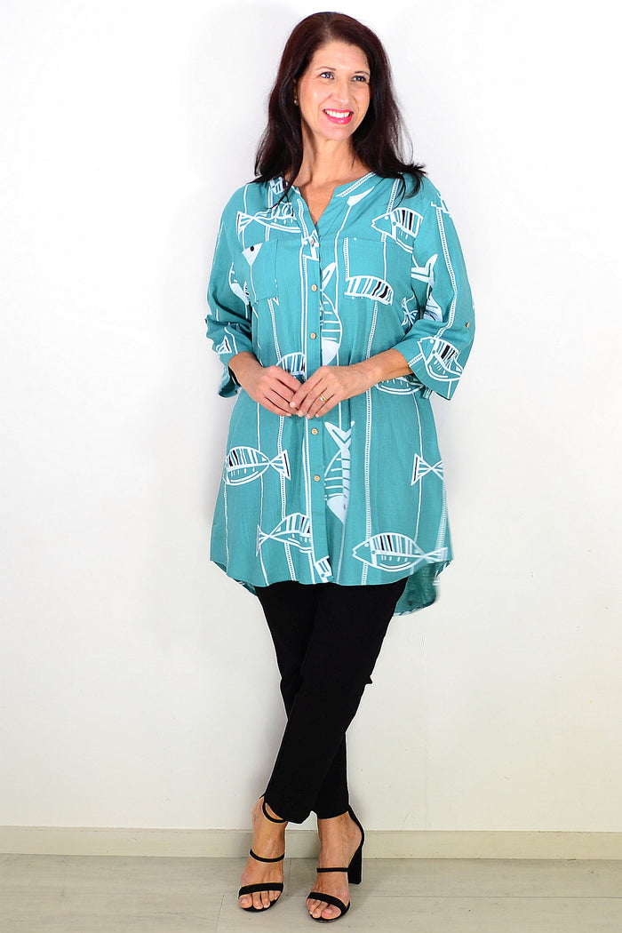 Green Ruby Rain relaxed hi-low tunic shirt with a loose fit, featuring a flowy silhouette and casual style.